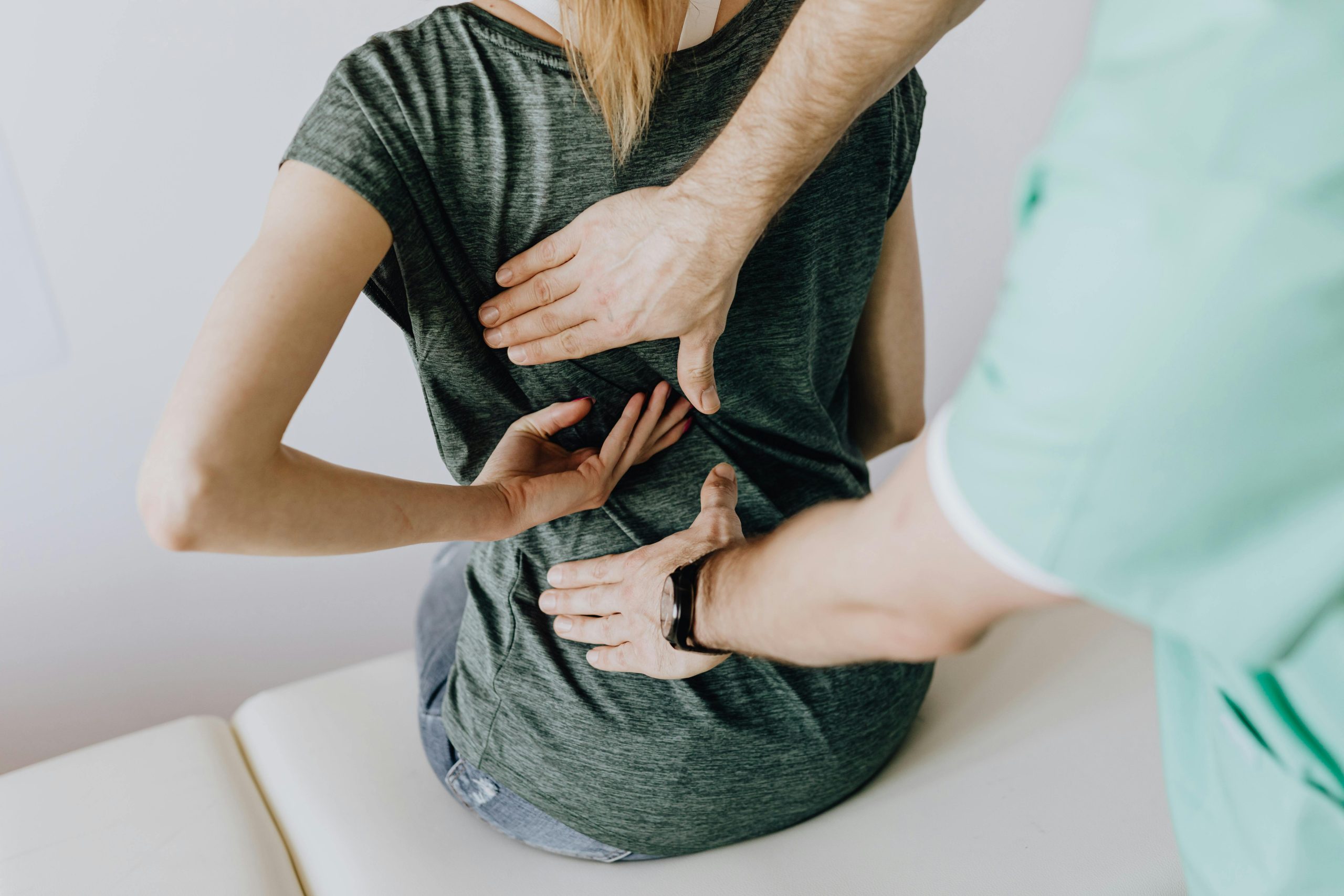 Chiropractor Helping Person With Herniated Disc